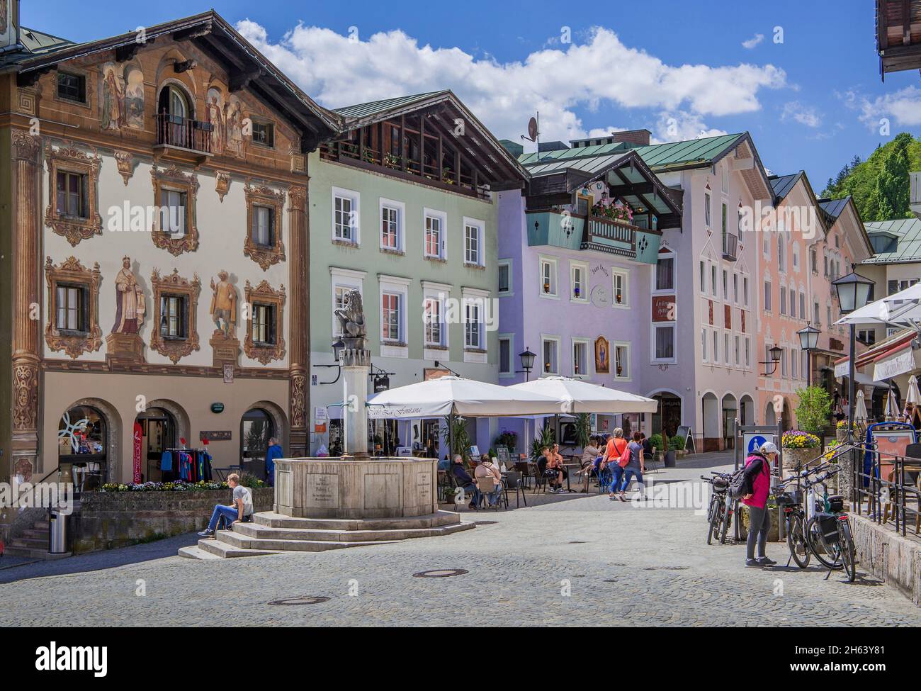 historic houses on the market square with market fountain and street cafe,berchtesgaden,berchtesgaden alps,berchtesgadener land,upper bavaria,bavaria,germany Stock Photo