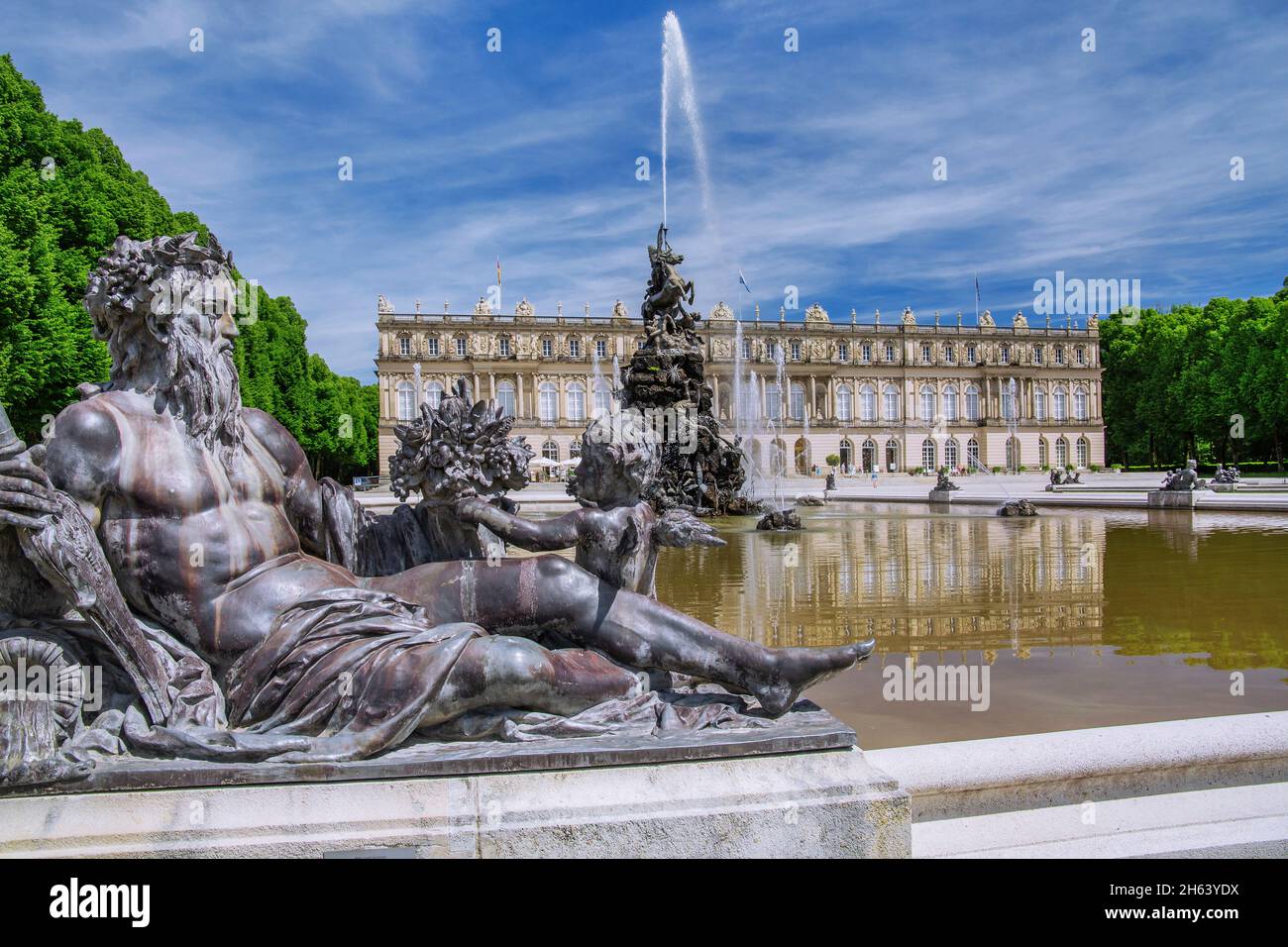 water parterre with fountain in front of the garden side of herrenchiemsee castle,municipality of chiemsee,herreninsel,chiemgau,upper bavaria,bavaria,germany Stock Photo