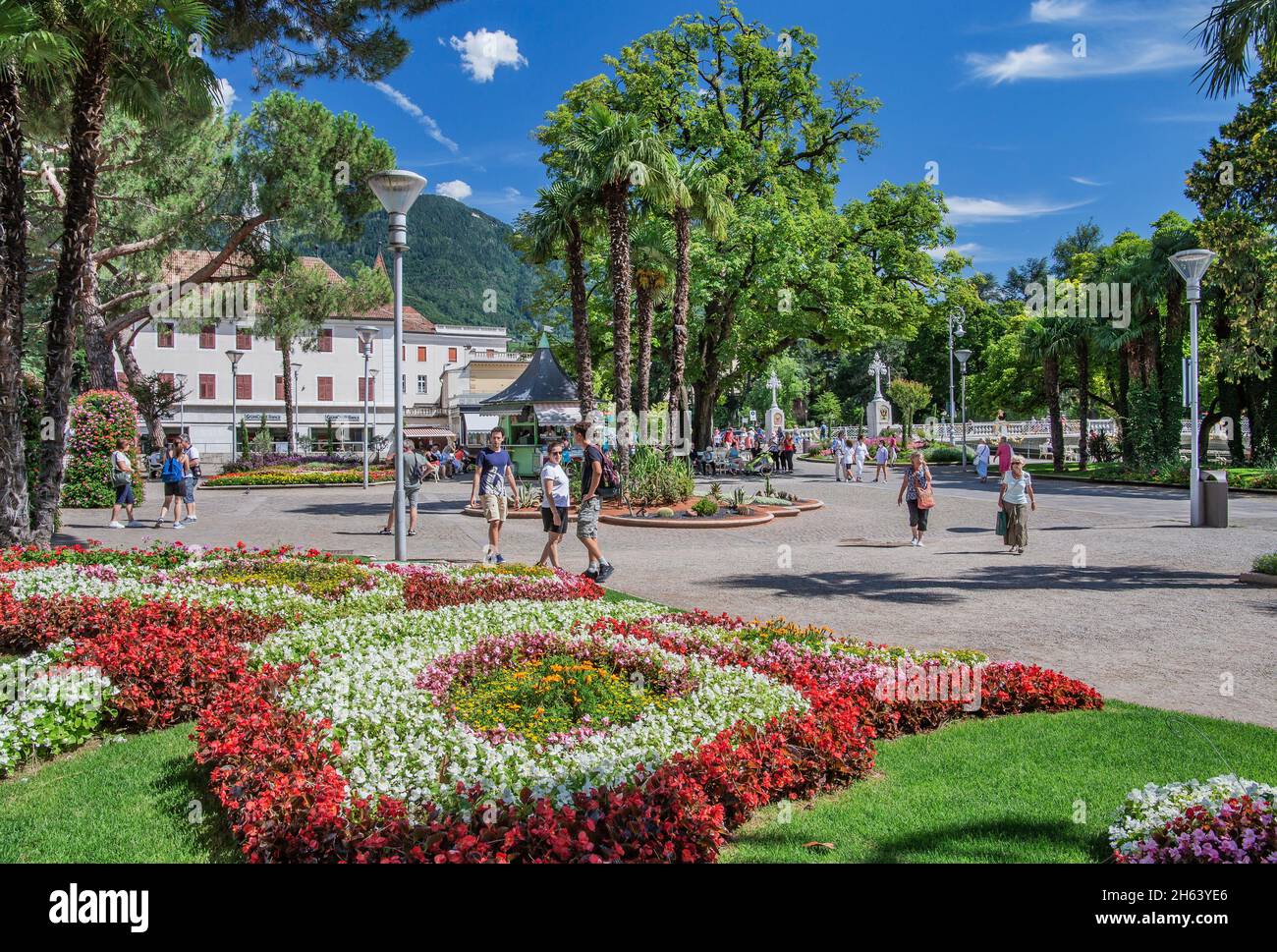 spa promenade with flower beds and palm trees,merano,etschtal,burggrafenamt,south tyrol,bolzano province,trentino-south tyrol,italy Stock Photo
