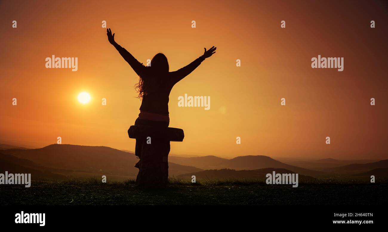 Happy Woman Enjoying Life In Field At Sunset In Mountains Stock Photo,  Picture and Royalty Free Image. Image 119496928.