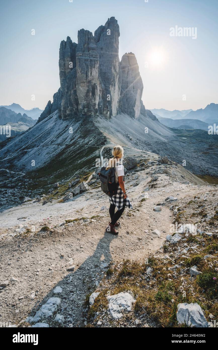 women hiker with backpack in hiking trail at the tre cime di lavaredo. dolomites,italy. Stock Photo