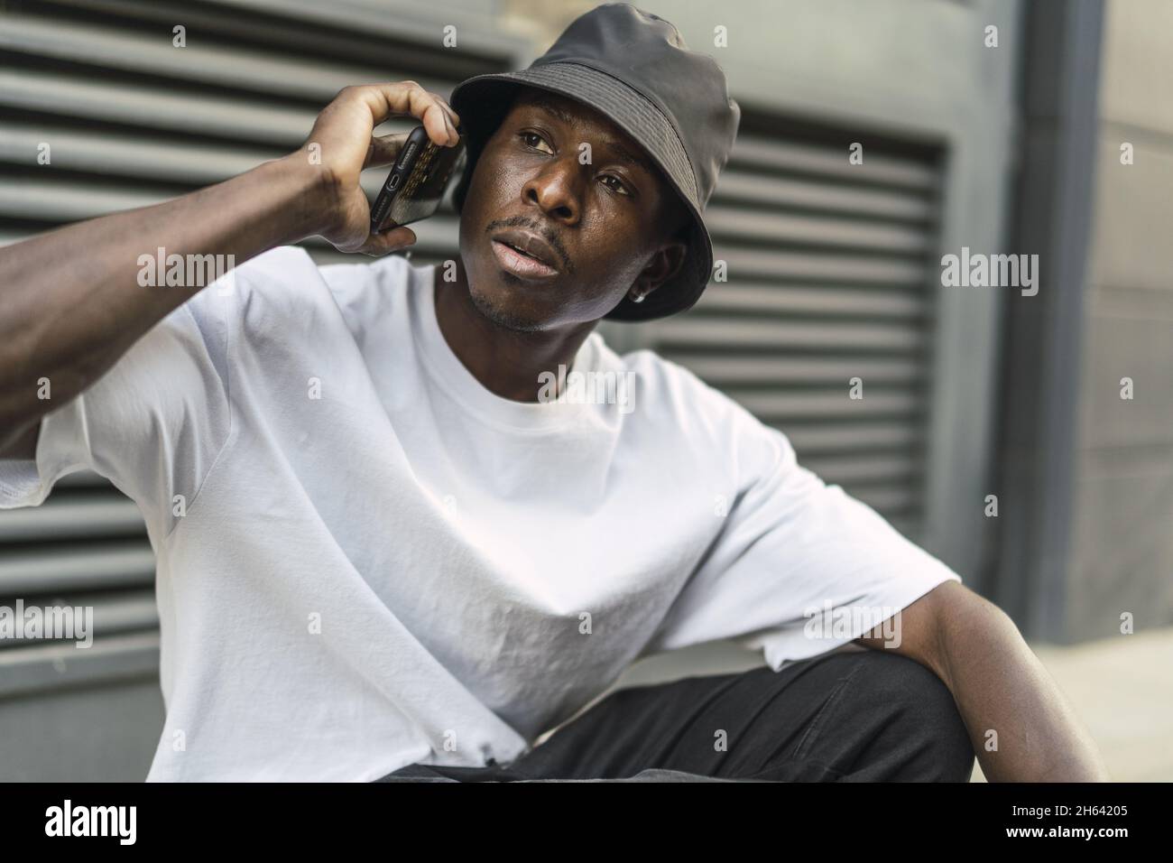 Young black african man talking hi-res stock photography and images - Alamy