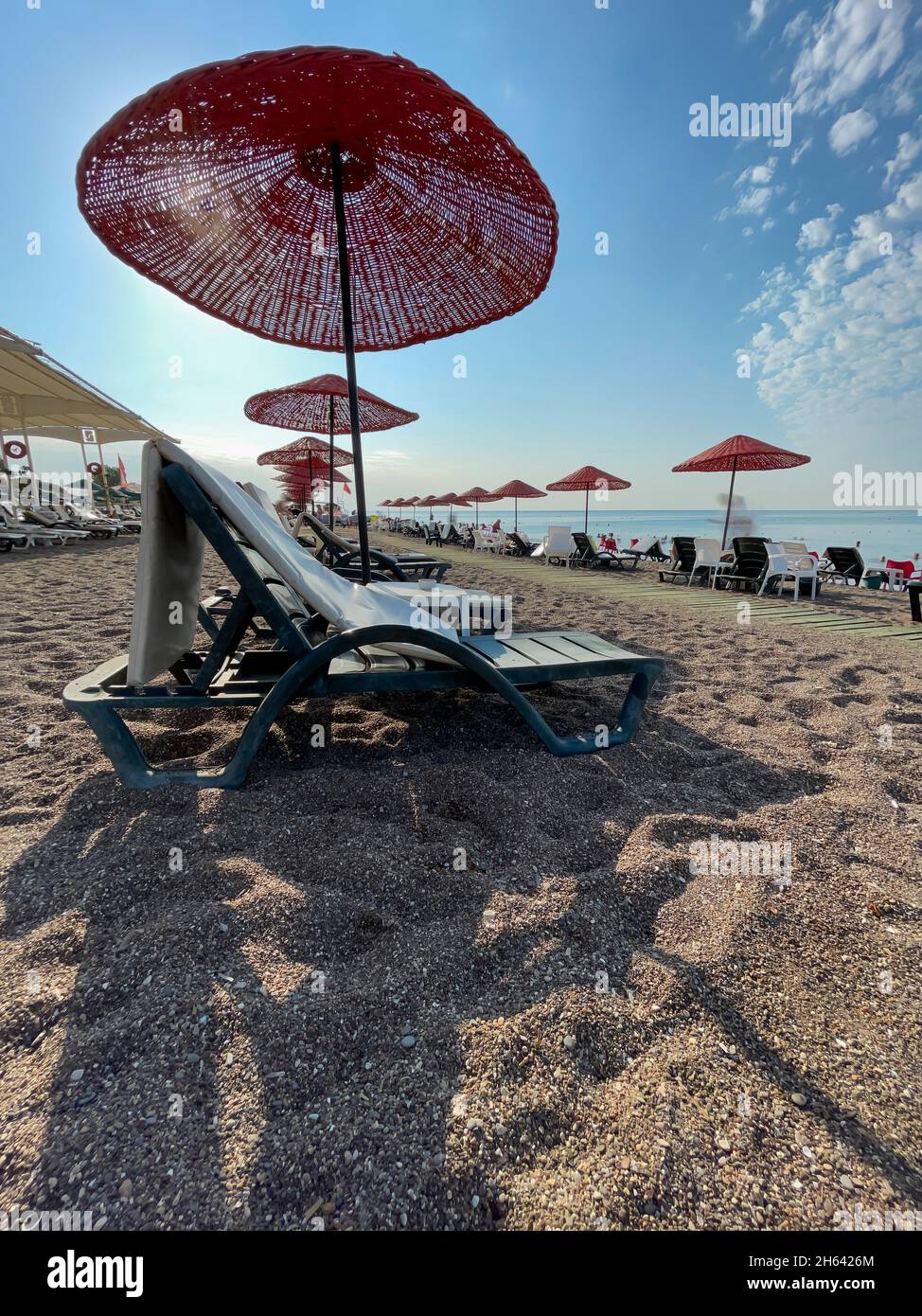 parasols and sun beds on lara beach,antalya,turkey Stock Photo