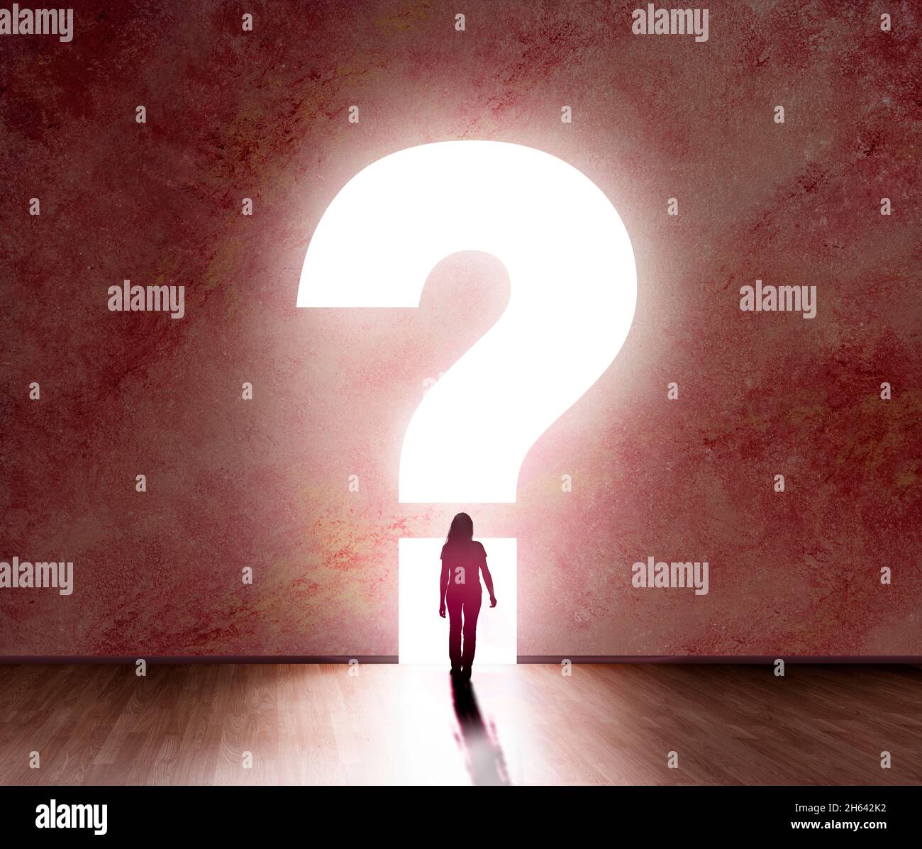silhouette of a female person in front of a question mark Stock Photo