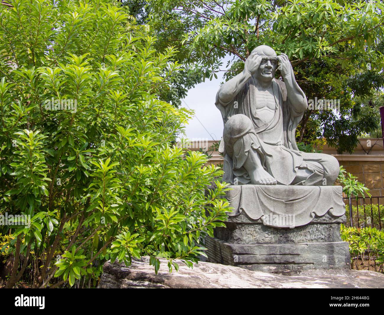 A Lohan statue at the Sutra Repository of Fo Guang Shan Buddha Museum in Kaohsiung, Taiwan. Stock Photo