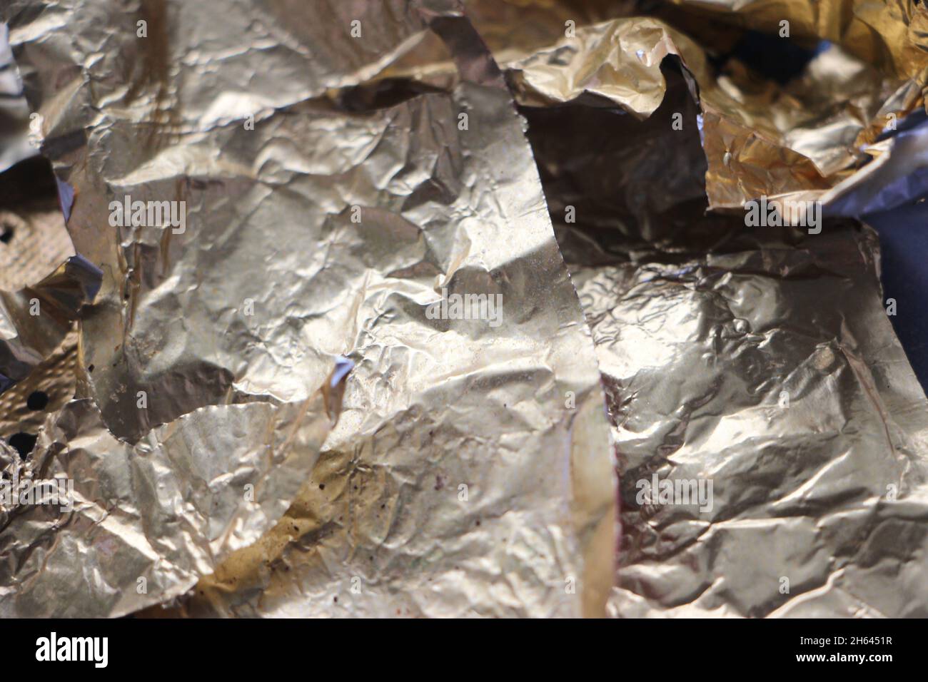 Shiny yellow leaf gold foil texture background. Stock Photo