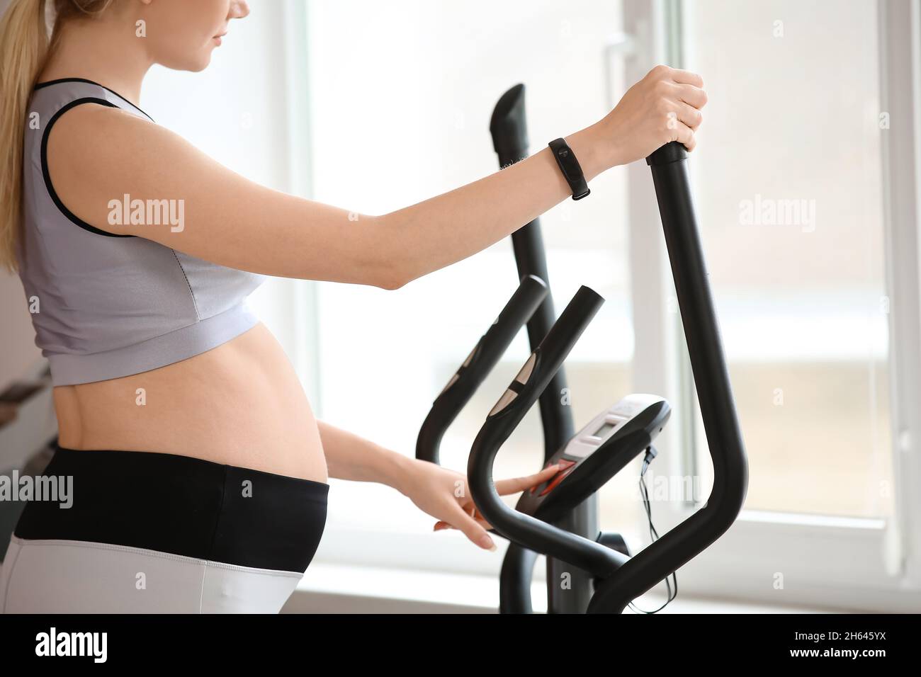 Young pregnant woman training with stair stepper in gym Stock Photo Alamy