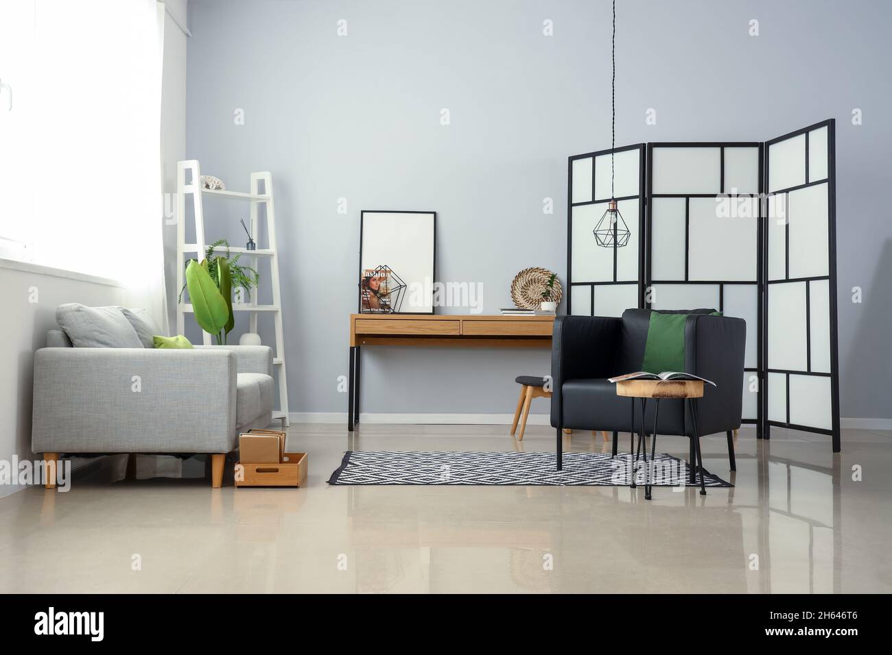 Interior of stylish living room with modern armchair and table Stock ...