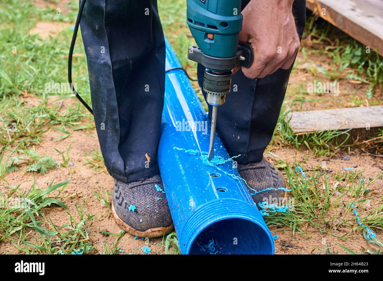 drill holes in a plastic pipe Stock Photo Alamy