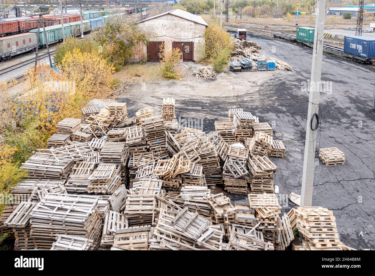 Heap of chaotically thrown wooden pallets in the traid depot station. Karaganda, Kazakhstan Stock Photo