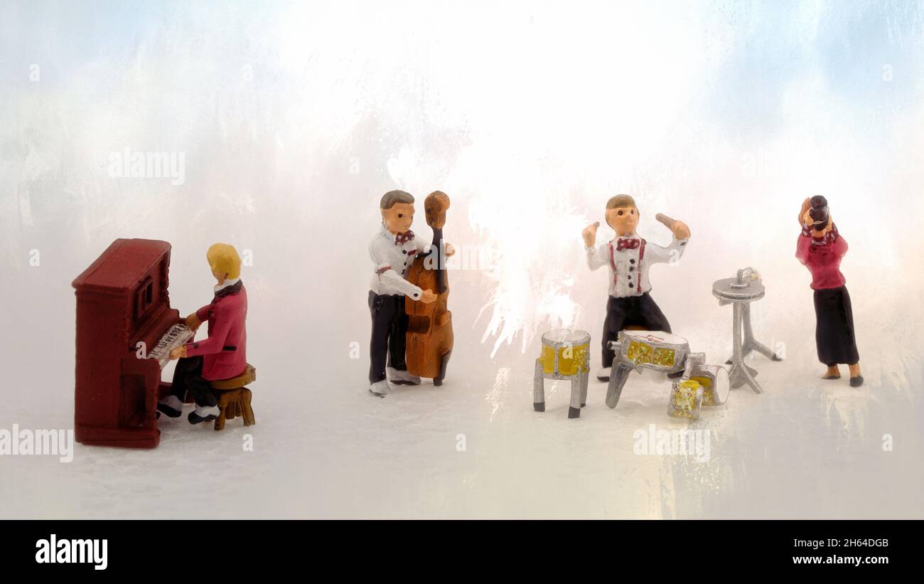 Miniature figurines playing in a band each with a music instrument