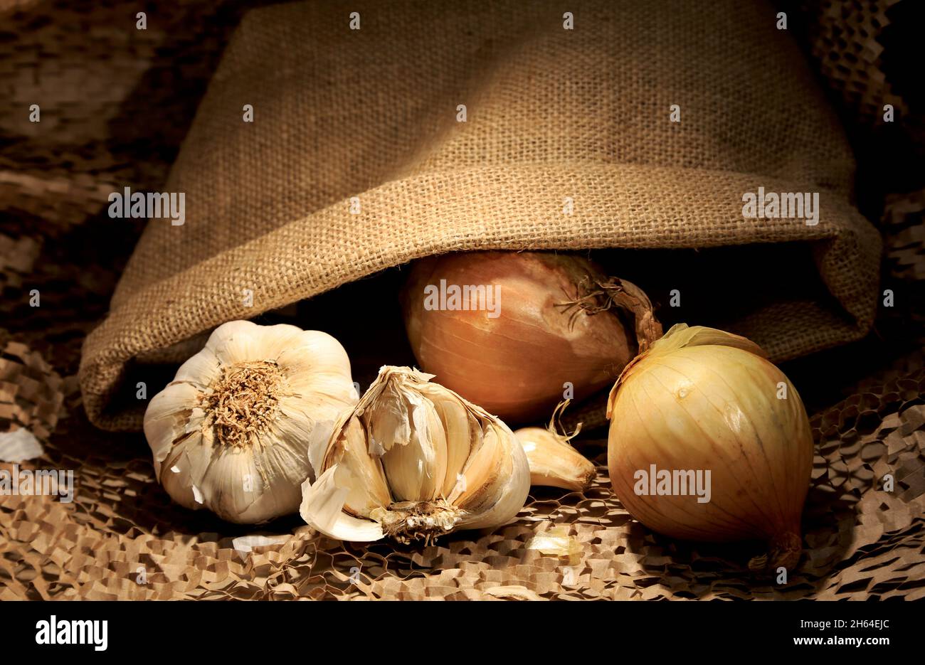 Onion and garlic with jute bag Stock Photo Alamy
