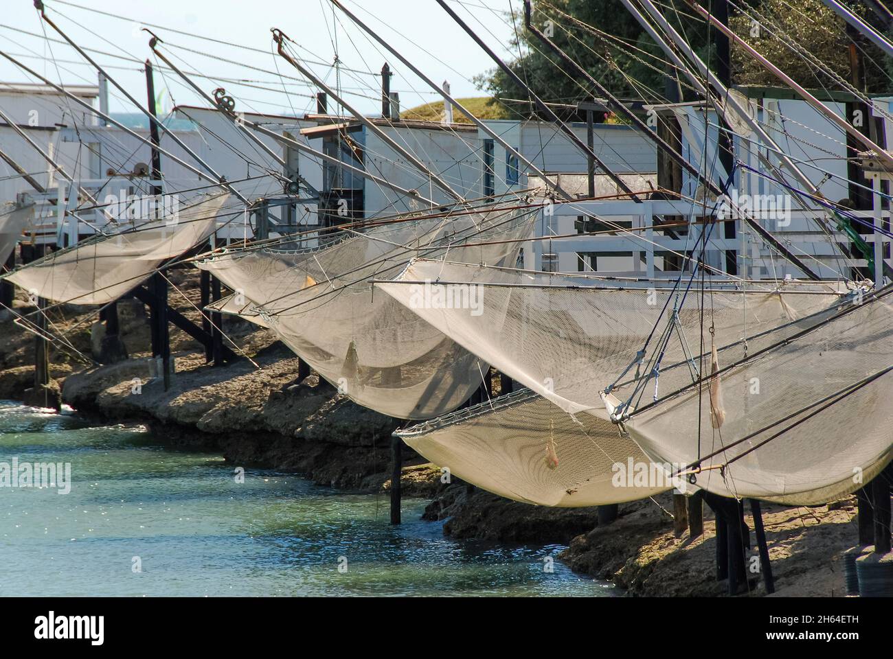 View of traditional fishing huts on stilts with suspended carrelets (fishing nets) along the