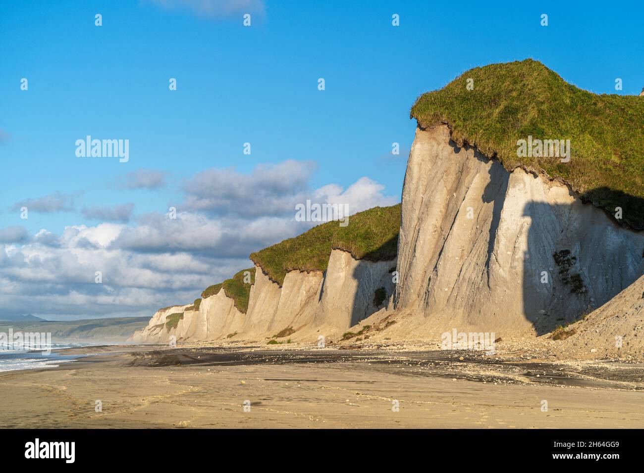 Russia, Kuril Islands, Iturup Island, White rocks on the coast of the Sea of Okhotsk. Stock Photo
