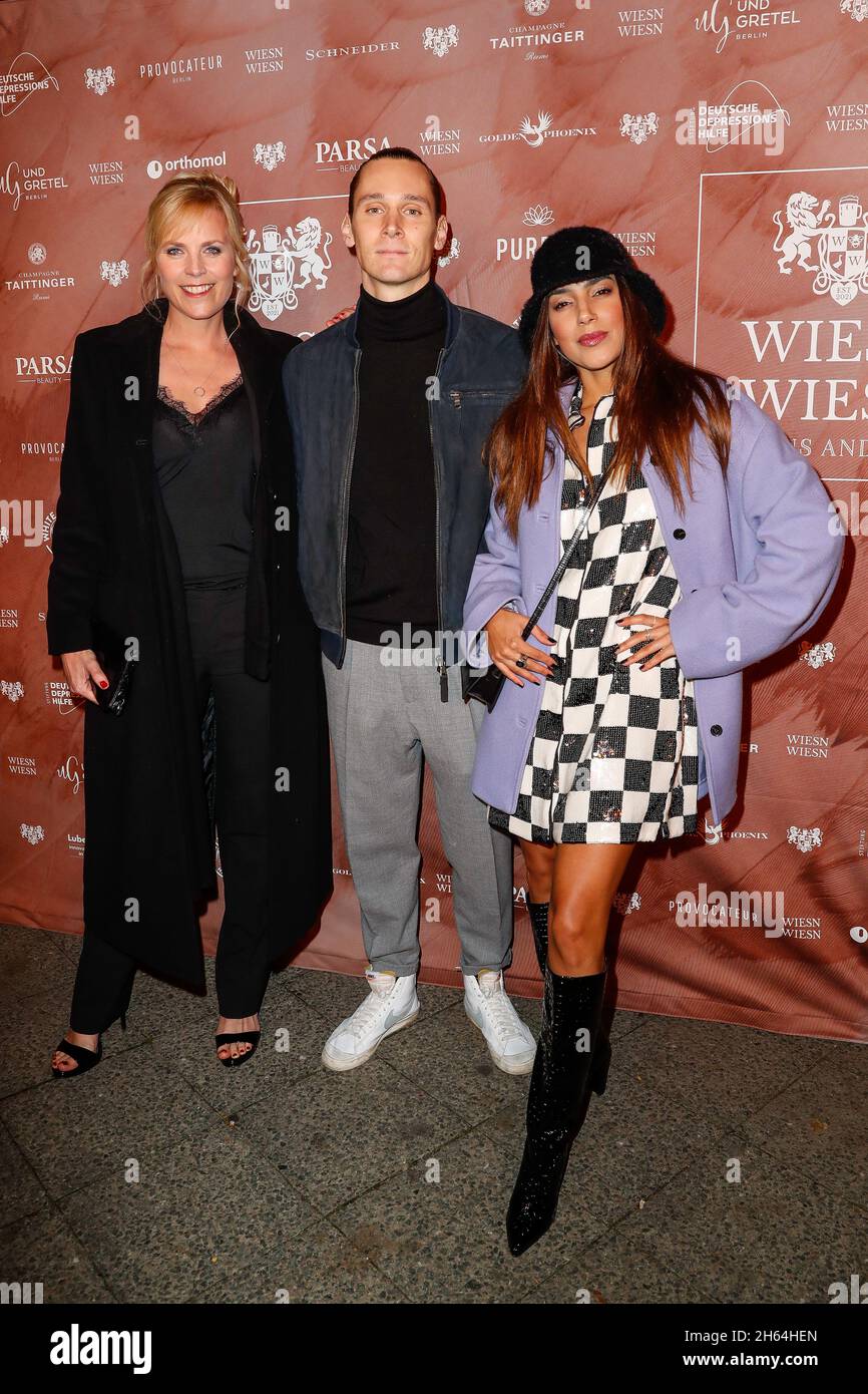 Berlin, Germany. 12th Nov, 2021. Melanie Marschke (l-r), Rick Okon and Amy Mussul arrive at the charity dinner 'WIESN WIESN Gans anders' at Hotel Provocateur. Credit: Gerald Matzka/dpa/Alamy Live News Stock Photo