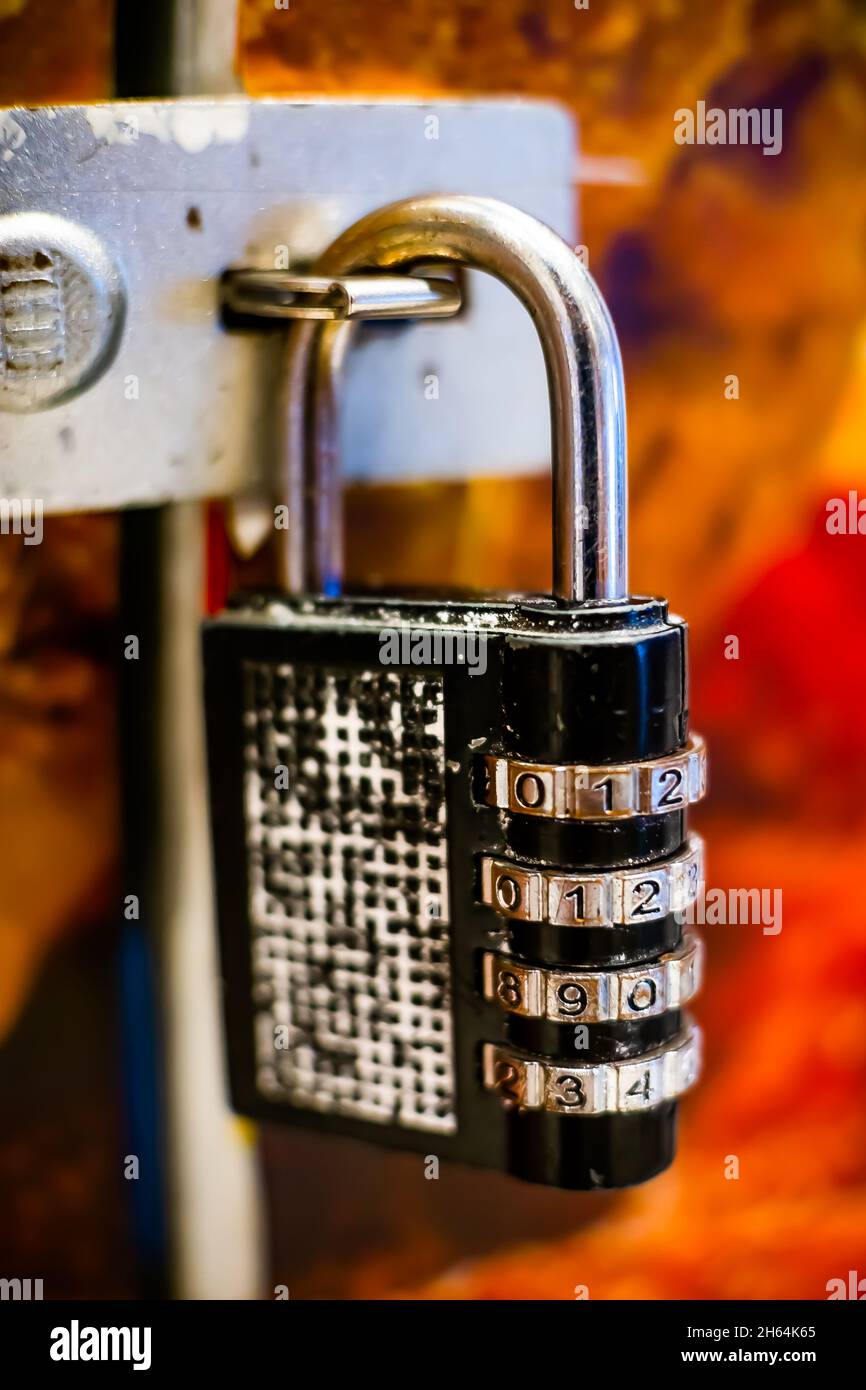 A combination digital pad lock keep a door locked in place Stock Photo Alamy