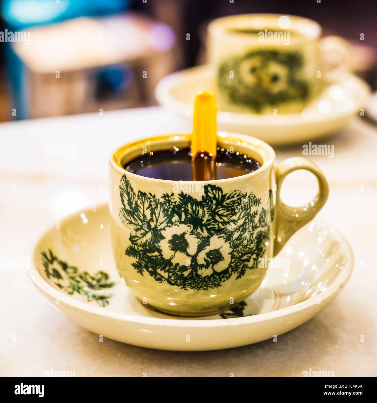 Traditional black coffee in Singapore Coffee Shop. Stock Photo