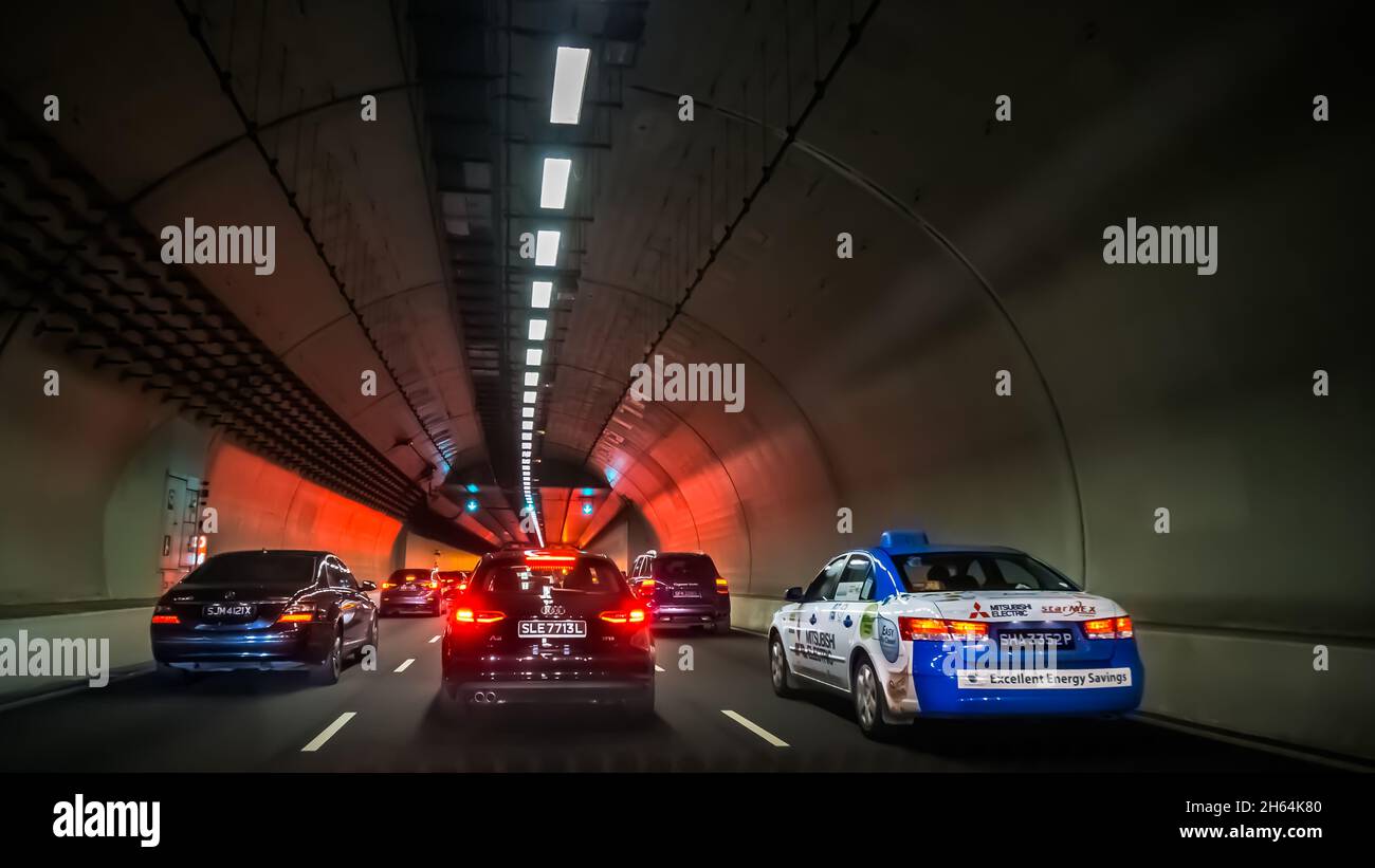 Vehicles travelling along Fort Canning Tunnel in the Central Area of Singapore. Stock Photo