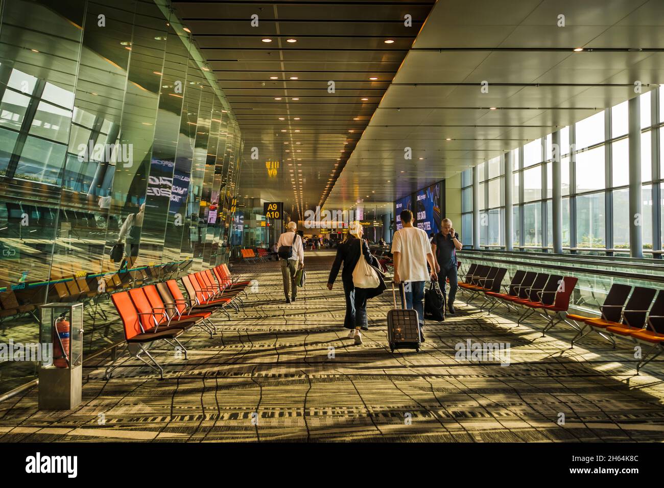 Travellers arriving in Changi Airport,Terminal 3, Singapore. Stock Photo