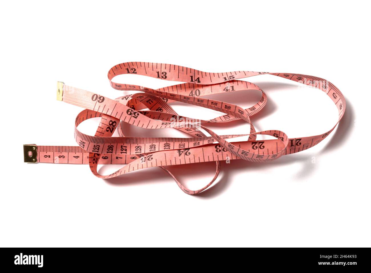 Pink measuring tape isolated on white background Stock Photo