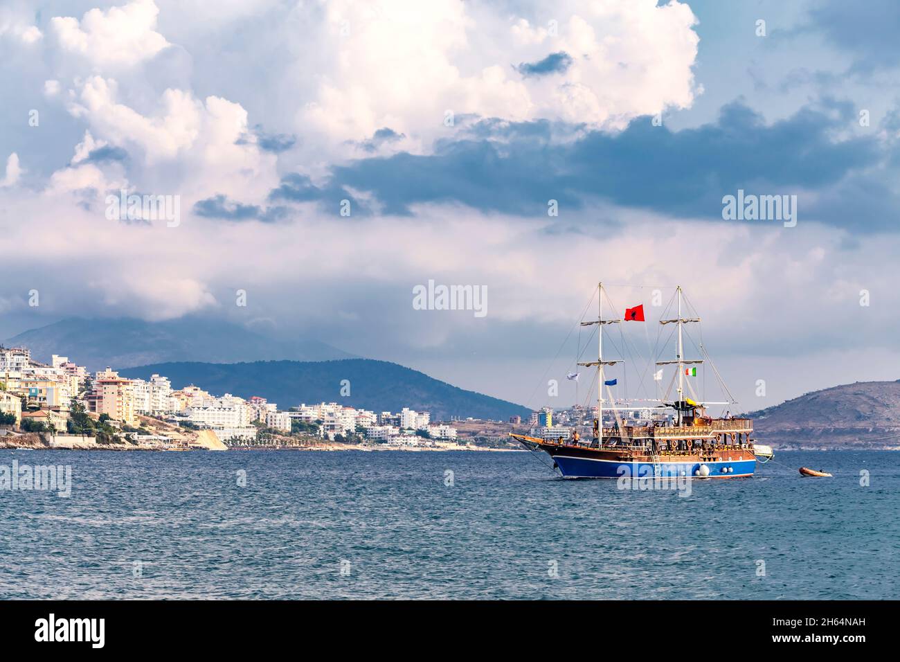 Vintage mast wooden sailing ship for sea tours in port of Saranda