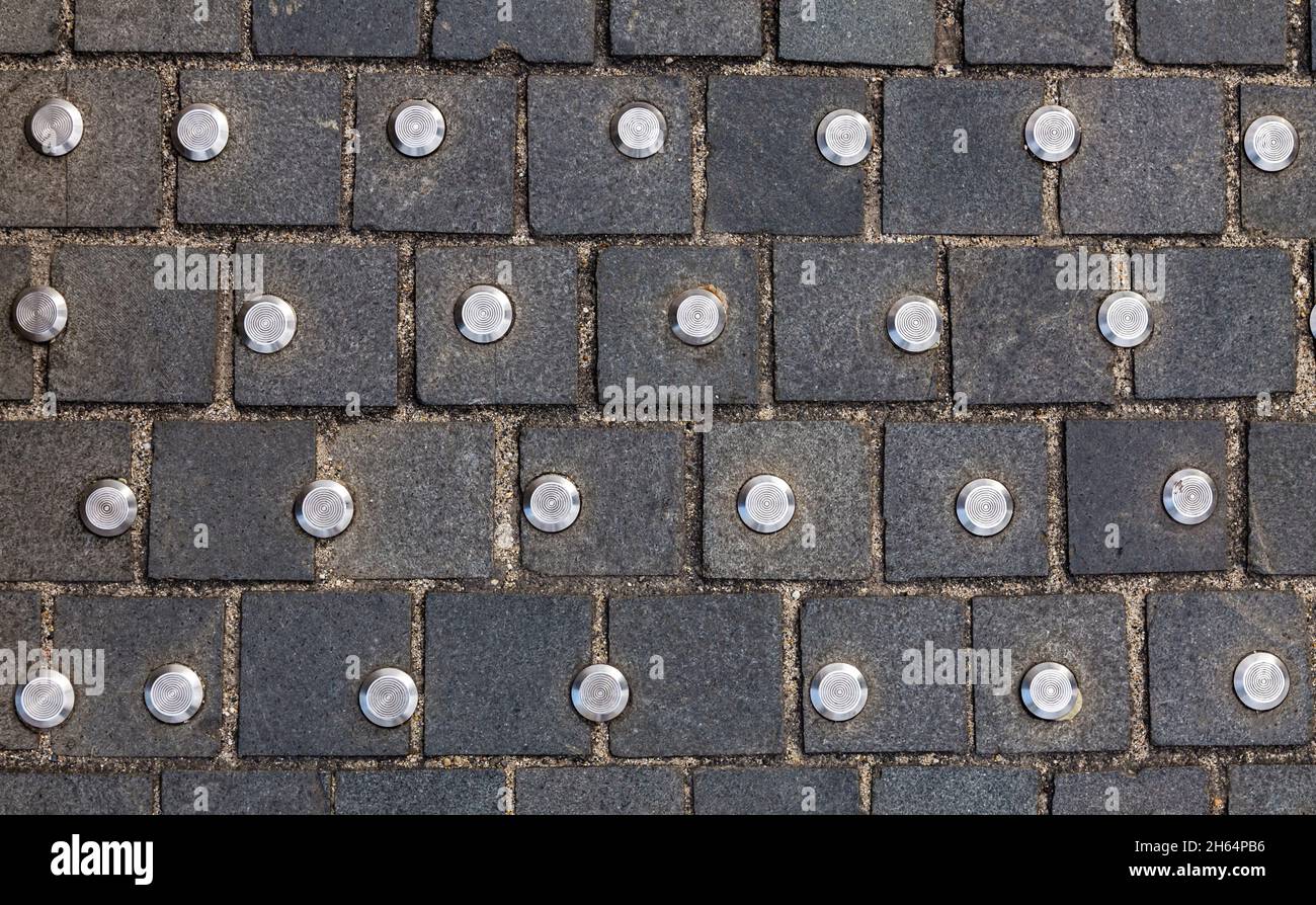 Tactile ground floor for blind, metallic dot on floor to help blind people walking Stock Photo