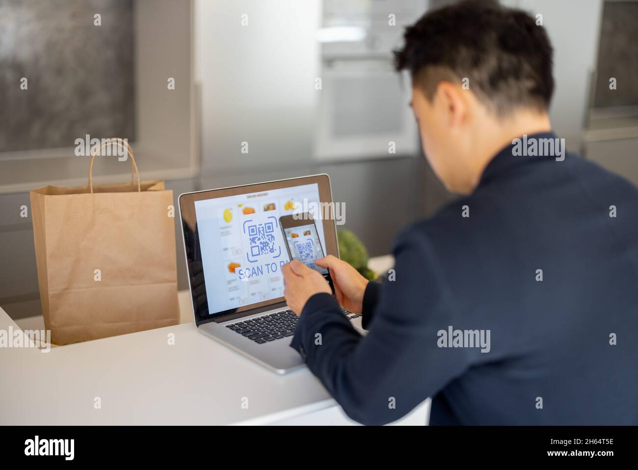 Man using smartphone for payment in online store Stock Photo