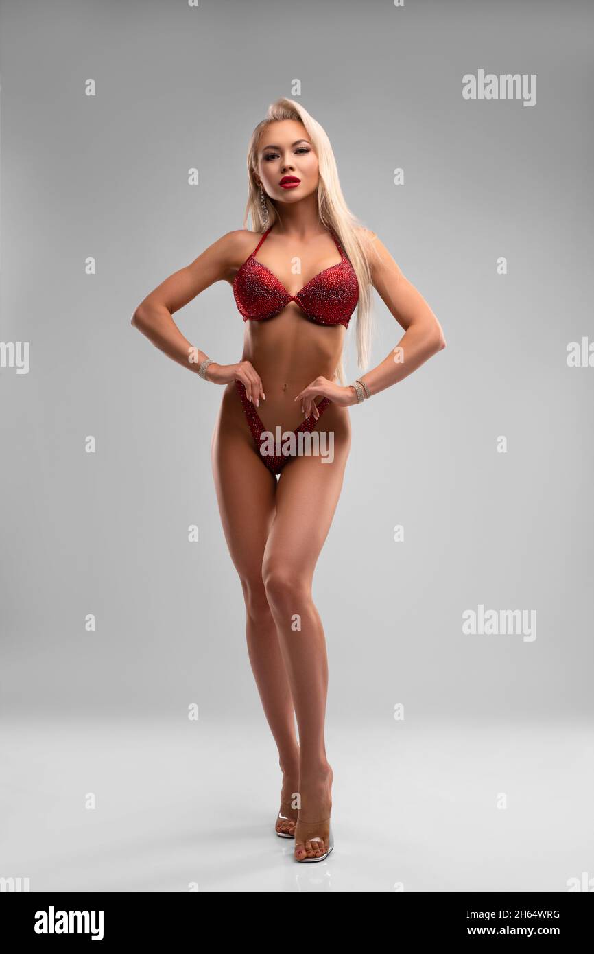 Competing woman in red lingerie and high heels Stock Photo