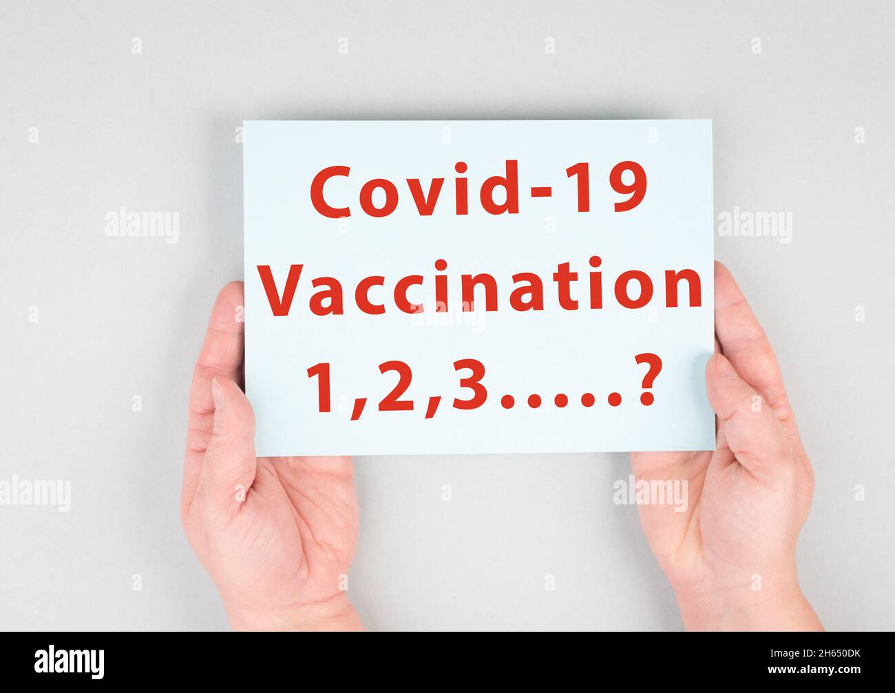 Covid-19 Vaccination, how many, vaccine breakthrough, holding message in the hand, health issue Stock Photo