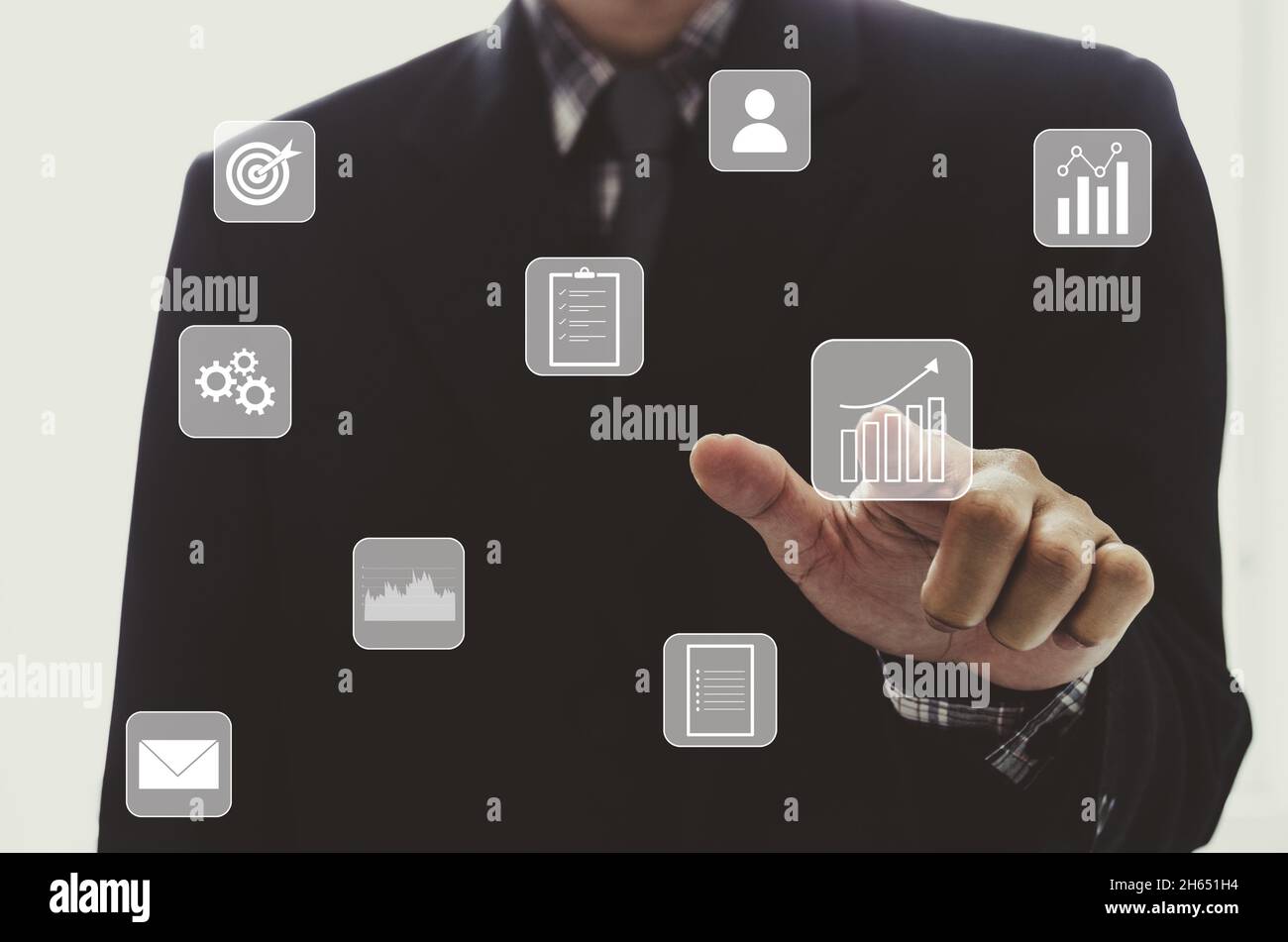 businessman touching digital business icon, network connection on modern virtual interface. Stock Photo