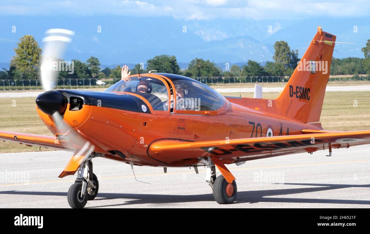 Rivolto del Friuli, Udine, Italy SEPTEMBER, 17, 2021 High performance low-wing propeller plane for training in orange taxiing with instructor and pickup on board. SIAI Marchetti SF-260 Stock Photo