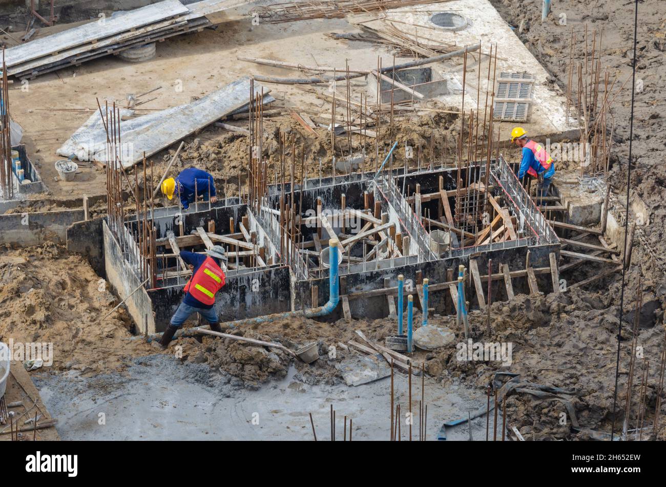 Construction workers build steel structures for cement mortar Stock Photo