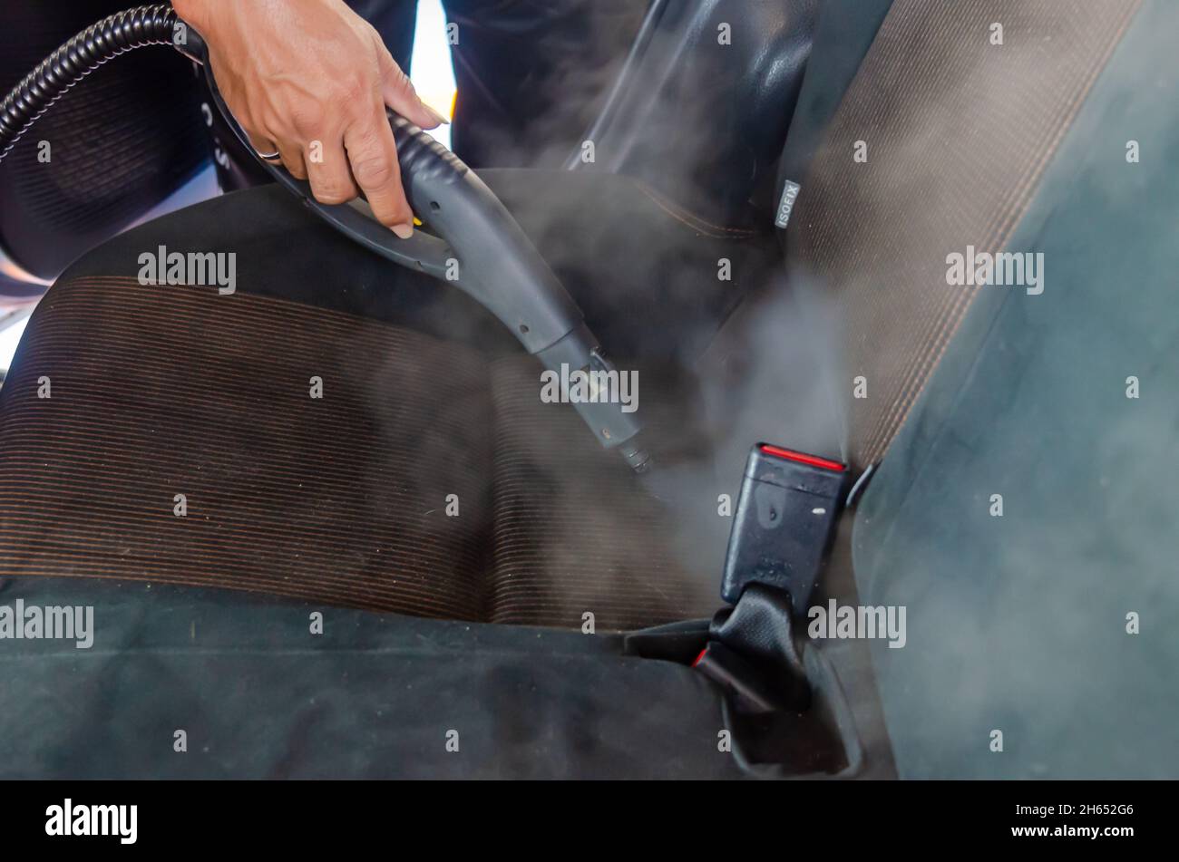 Steam the car seats. Use high heat steam to kill germs to clean Stock