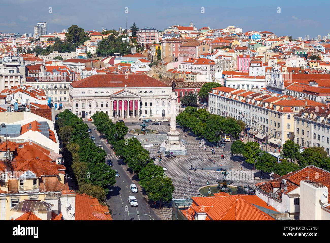 Lisbon, Portugal. Praca Dom Pedro IV, commonly known as Rossio.  The white building is the National Theatre, Teatro Nacional Dona Maria II.  The colum Stock Photo