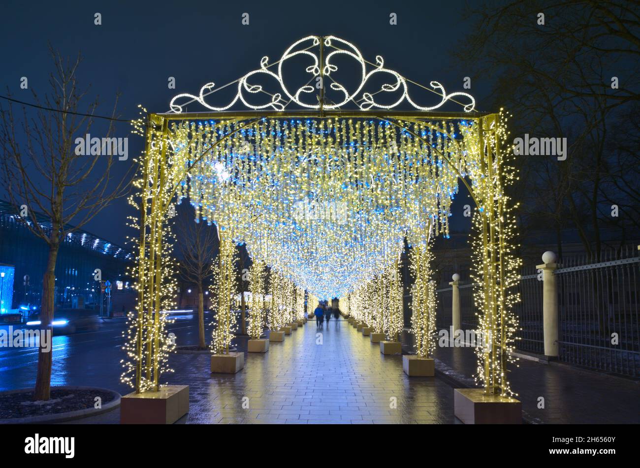 Lights glowing tunnel on the street of Moscow - New Year and Christmas decoration. Stock Photo