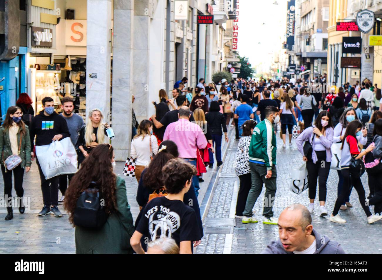 Athens, Greece November 07, 2021 Crowd people walking and shopping at