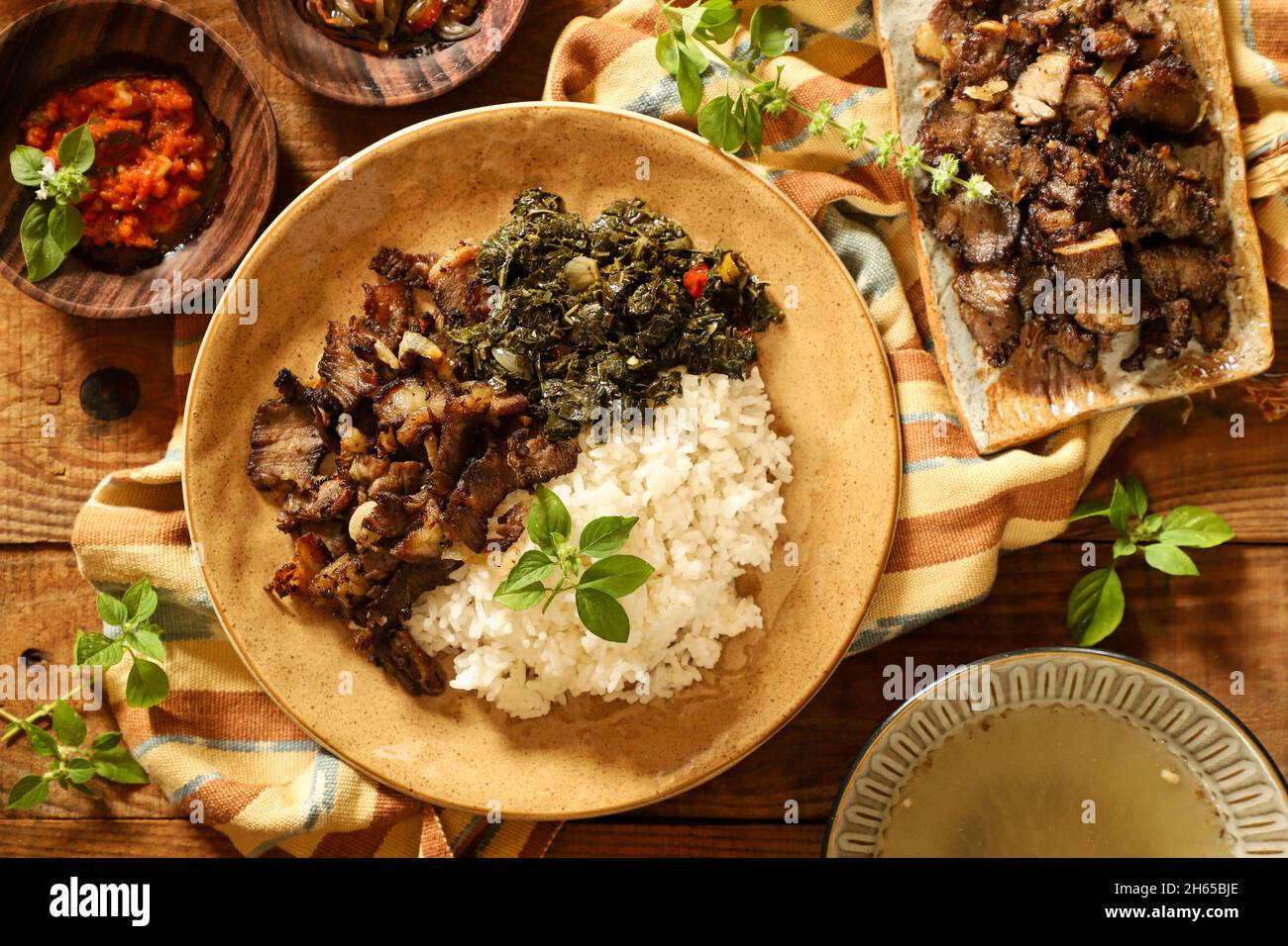 Se'i Sapi. Smoked beef dish from Nusa Tenggara Timur, served with rice and cassava leaves Stock Photo