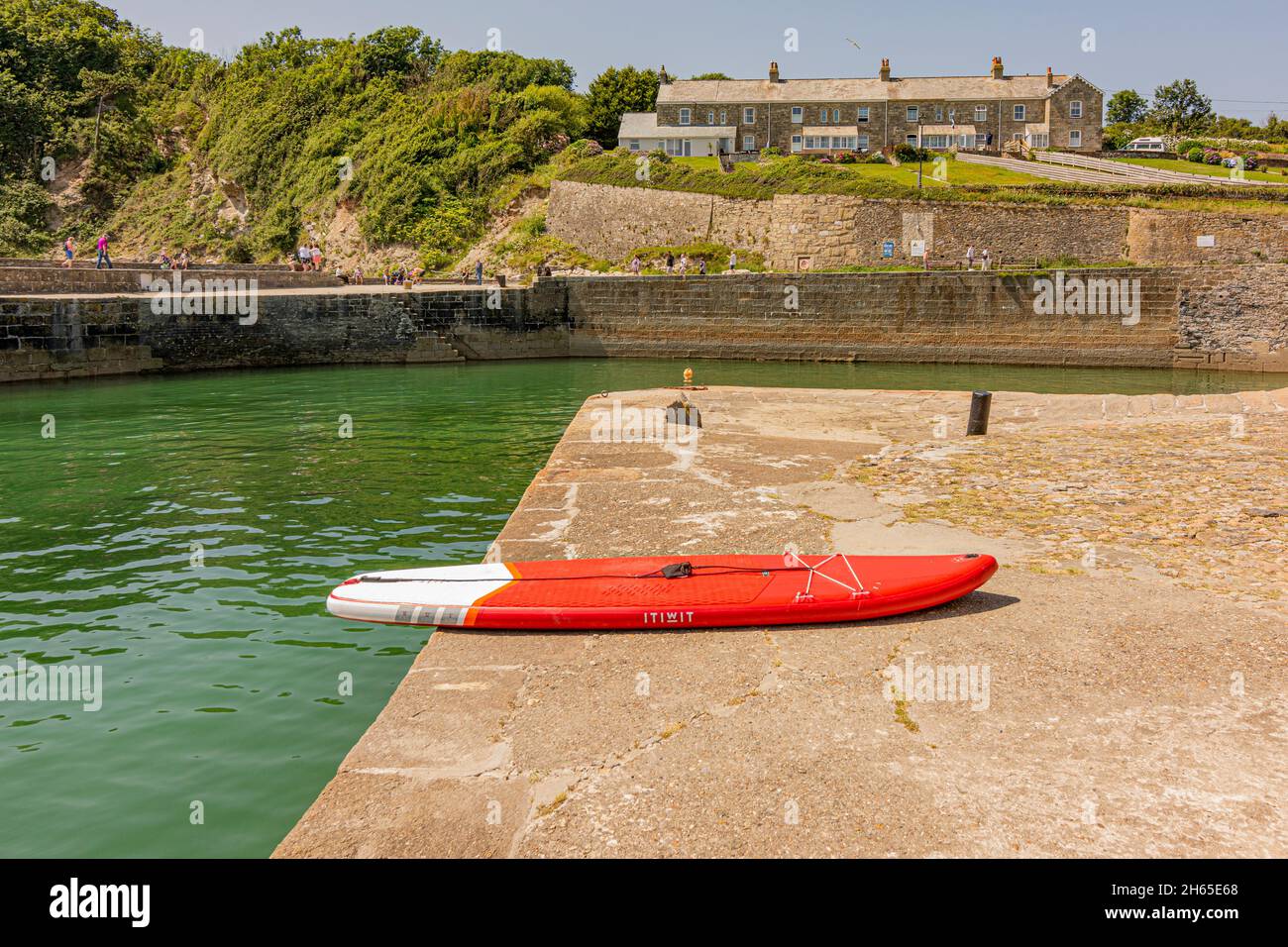Part of Charlestown harbour where paddleboards can be hired by visitors - Charlestown, Cornwall, UK. Stock Photo