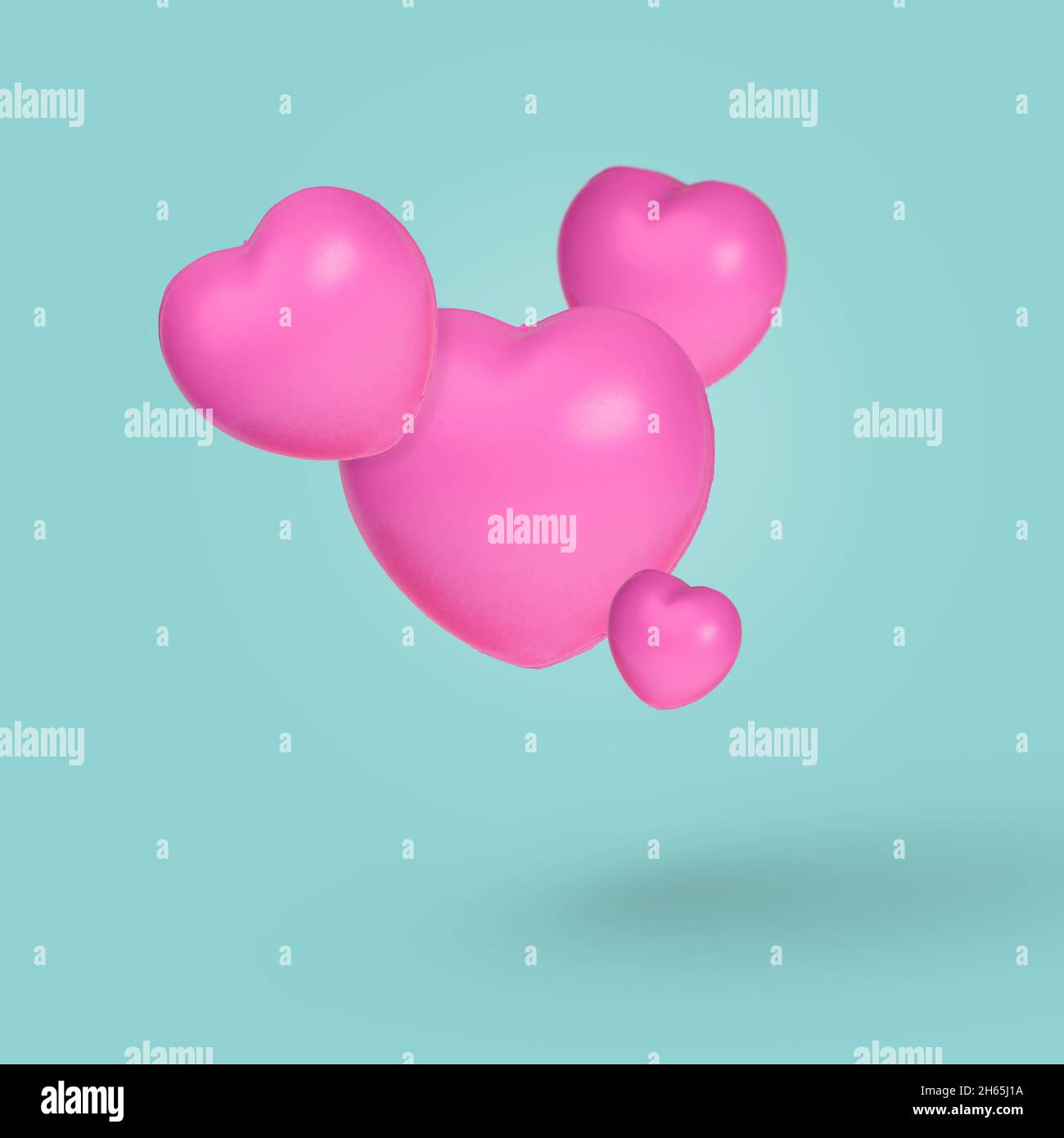 Creative idea with floating hearts in the air on pastel blue background ...