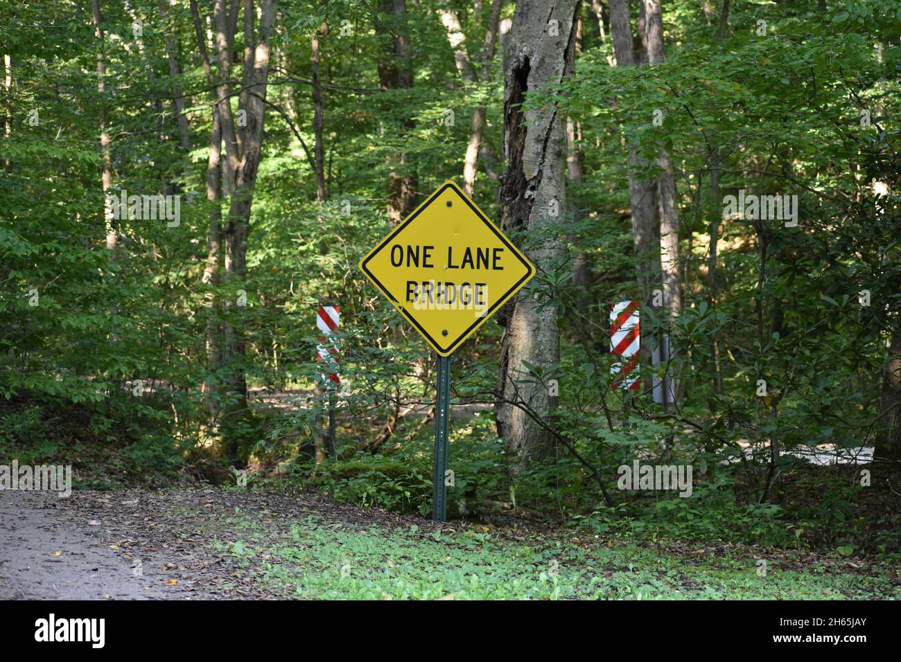 One lane bridge yellow sign Stock Photo