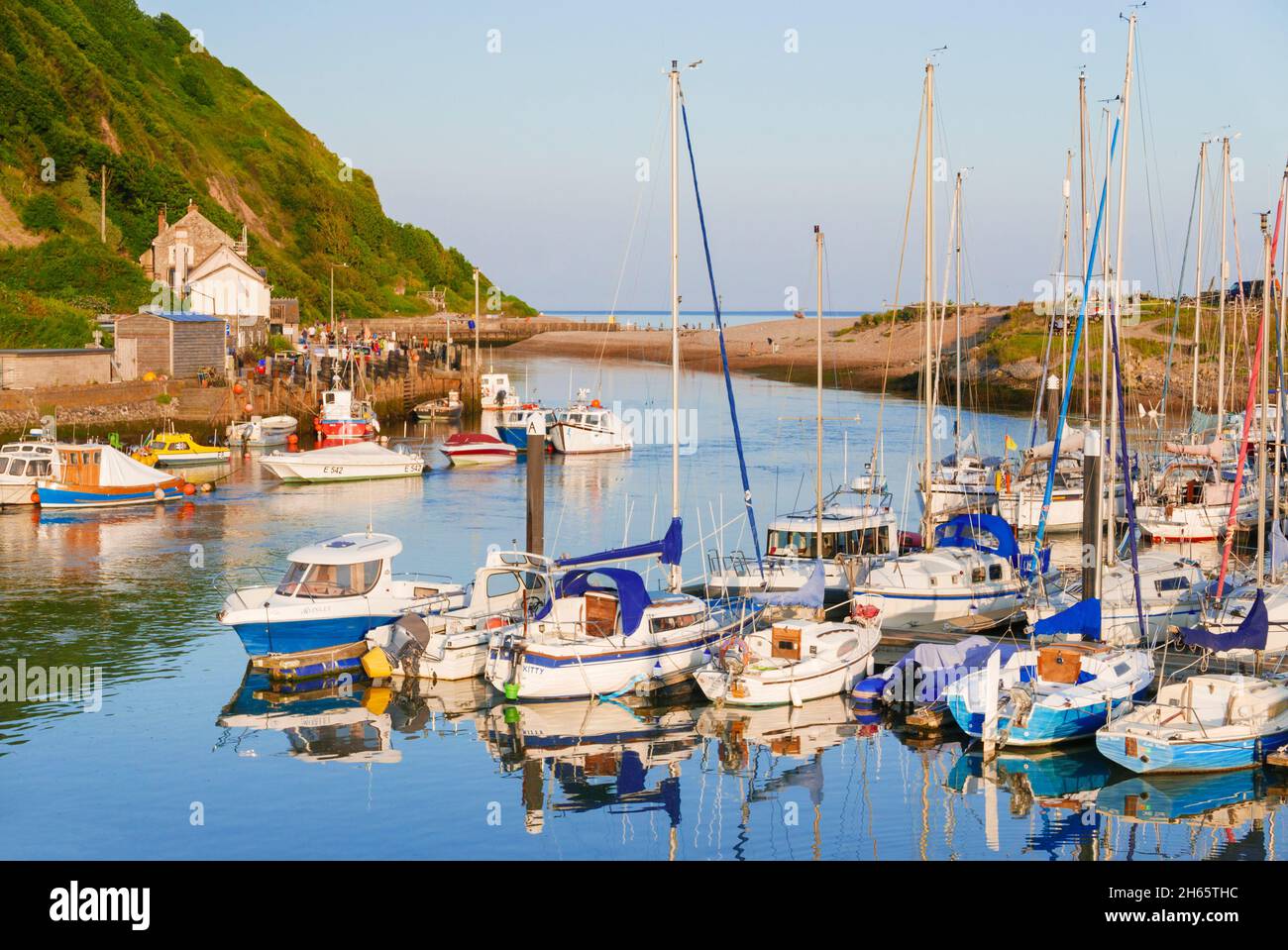 Yachts in Axe Yacht club in Axmouth harbour on the River Axe at Haven Cliffs Seaton Devon England UK GB Europe Stock Photo
