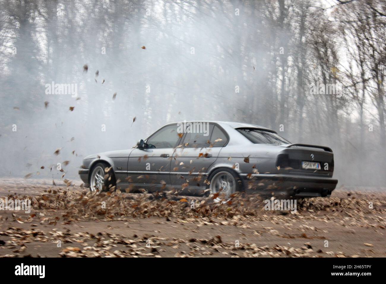 BMW M5, model year 2005-, black, driving, diagonal from the front, frontal  view, test track, Drift, drifting Stock Photo - Alamy