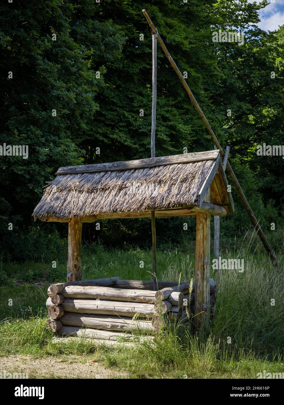 An old wooden well. Bedkowice Archeological Reserve, Sobotka, Poland. Stock Photo