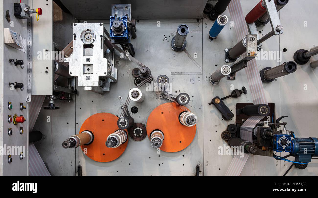 Rotary die cutting machine with slitting blade system. Production of