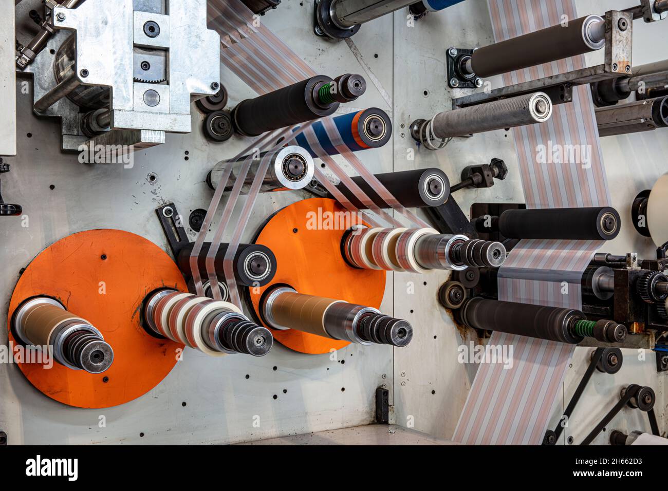 Rotary die cutting machine with slitting blade system. Production of