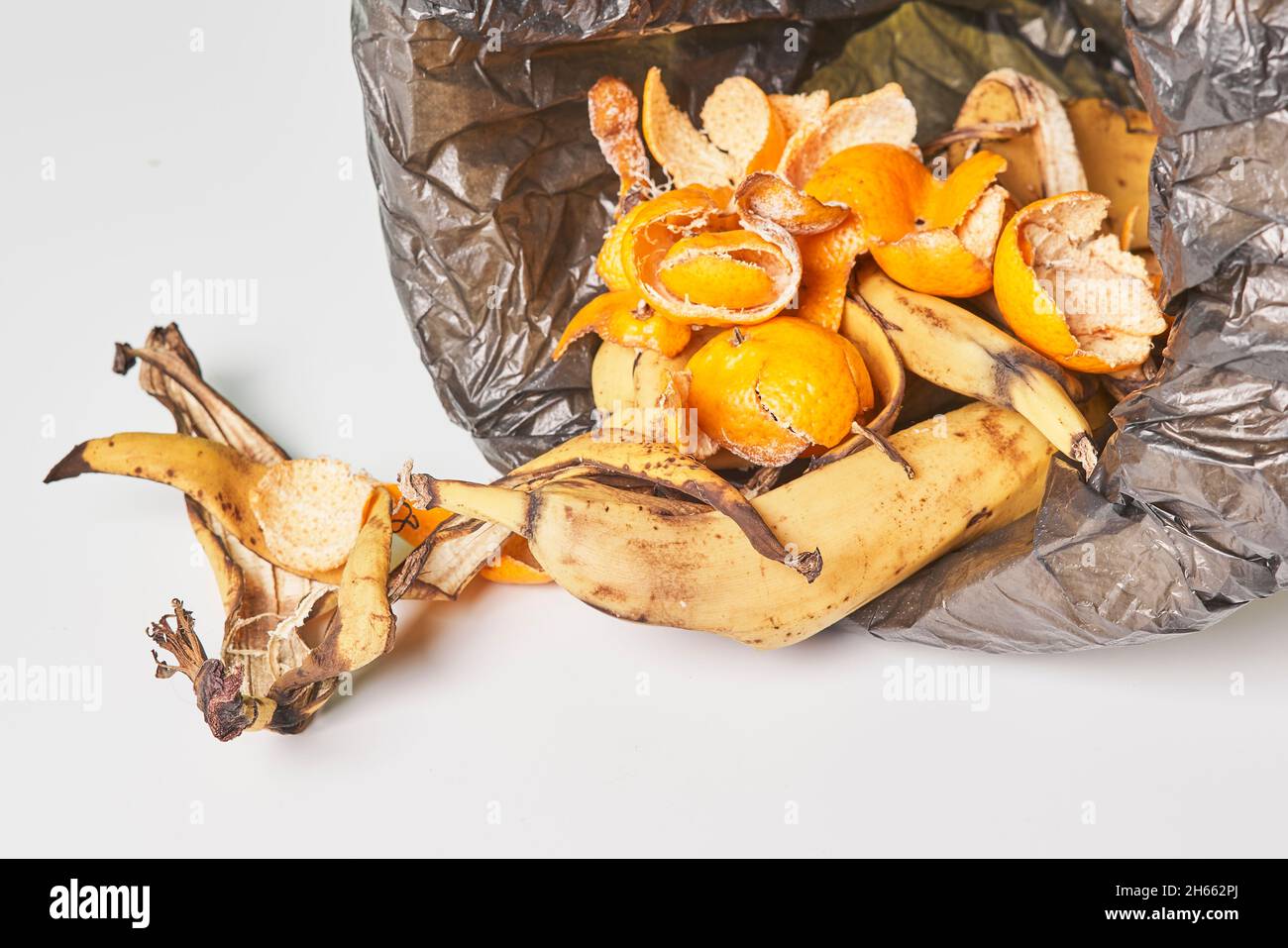 Banana peels in trash can. Using banana peels in compost. Banana skin