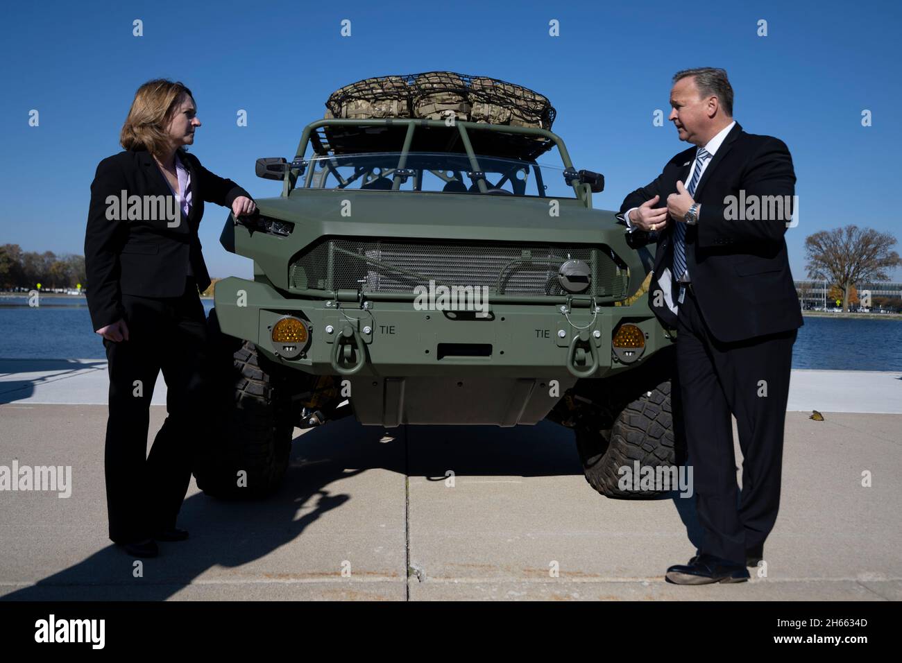Warren, United States of America. 08 November, 2021. U.S. Deputy Secretary of Defense Kathleen H. Hicks, left, speaks with Stephen duMont, President, GM Defense while viewing the military prototype electric Light Reconnaissance Vehicle at the GM Technical Center, November 8, 2021 in Warren, Michigan.  Credit: Chad McNeeley/DOD photo/Alamy Live News Stock Photo