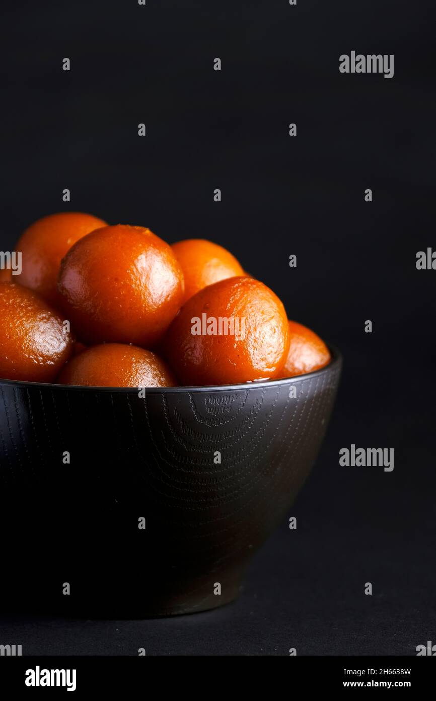 Indian Traditional Special Sweet Food Gulab Jamun, Indian Dessert or Sweet Dish, popular festival or wedding food. Stock Photo
