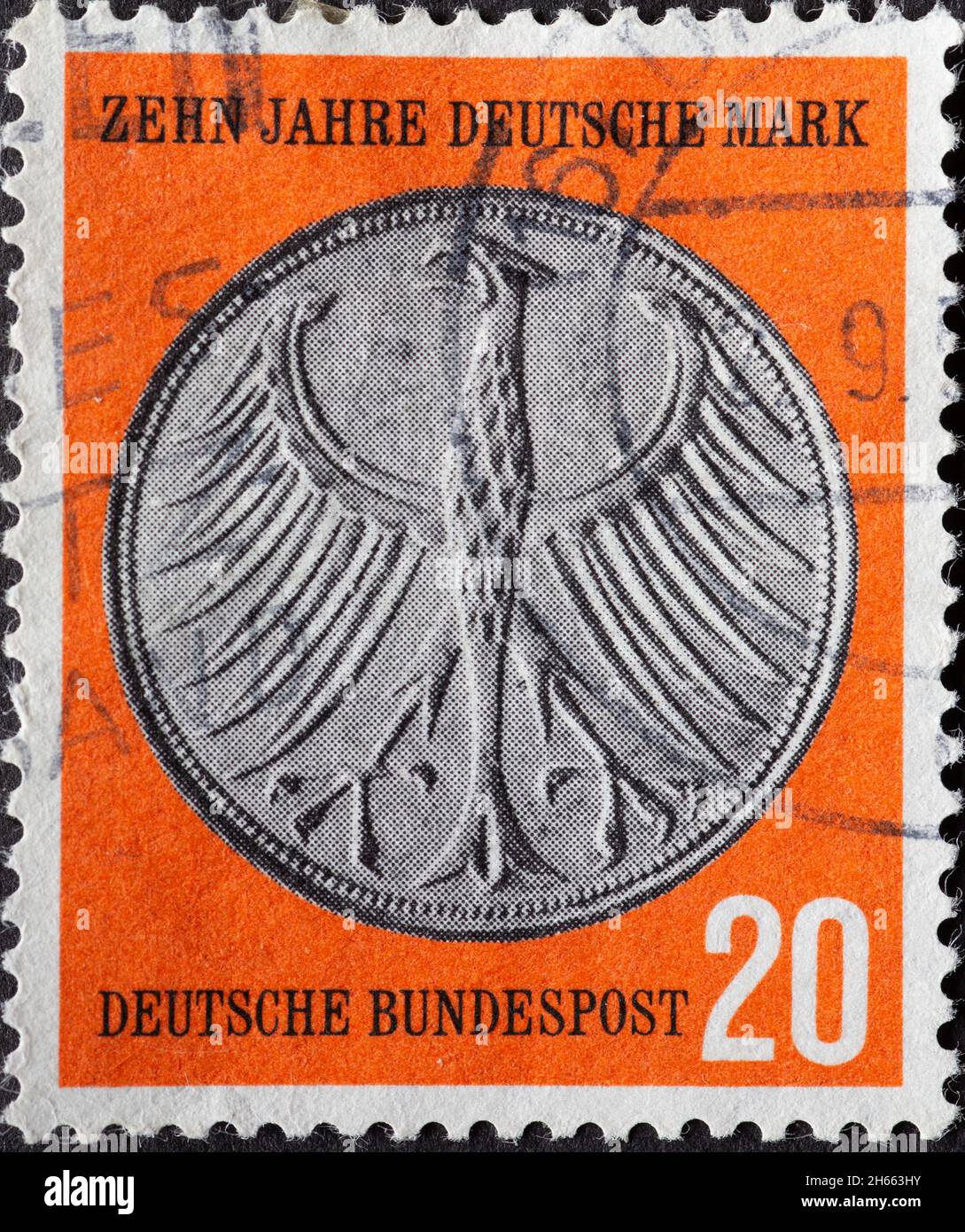 GERMANY - CIRCA 1958: The post stamp printed in Germany was published on the occasion of the 10th anniversary of the German Mark (DM) The eagle from t Stock Photo