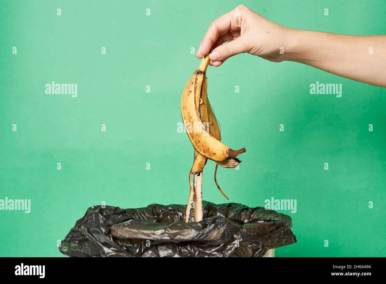 Woman Throwing Banana Peels In Trash Can Throw Out Banana Peels In